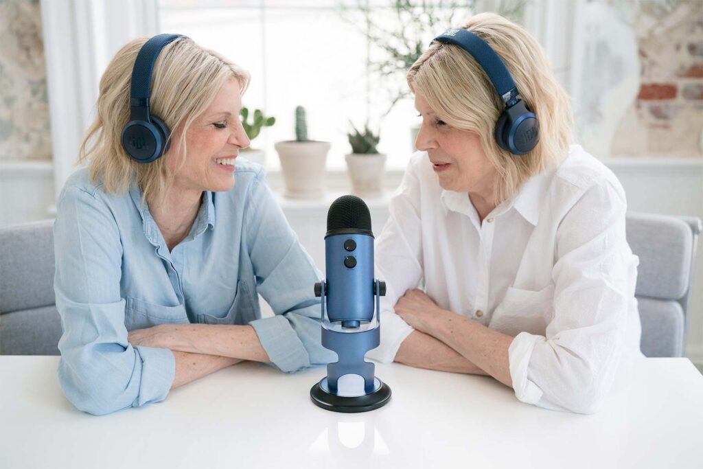 The Therapy Twins talking on a microphone