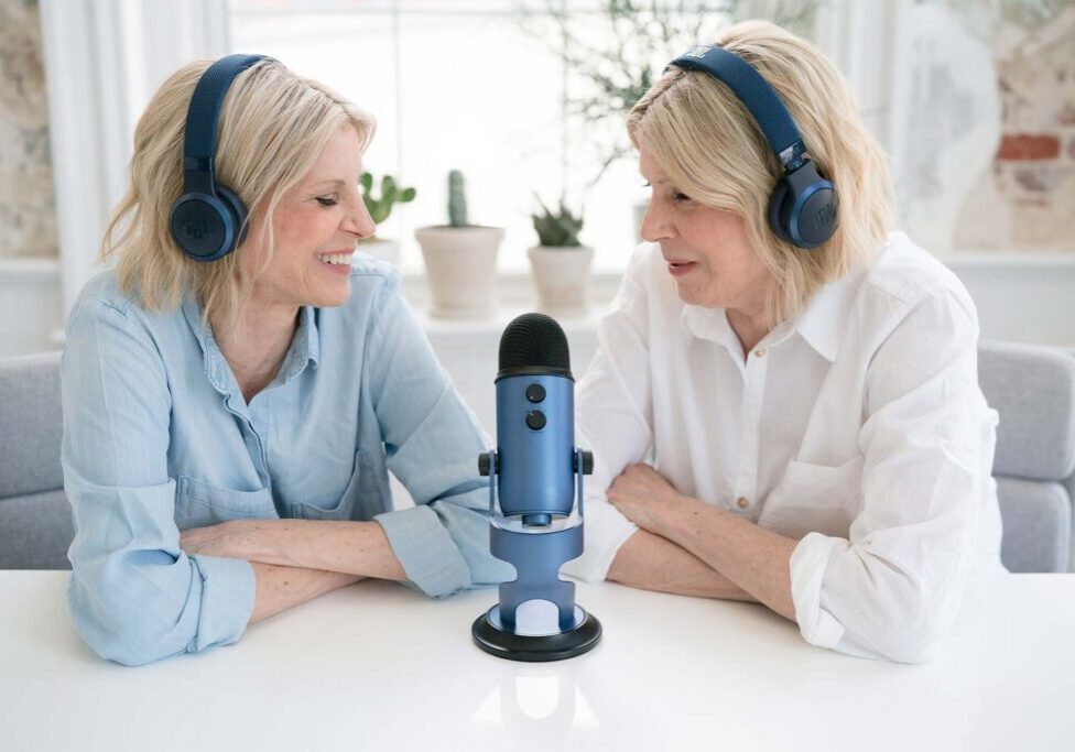 The Therapy Twins talking on a microphone